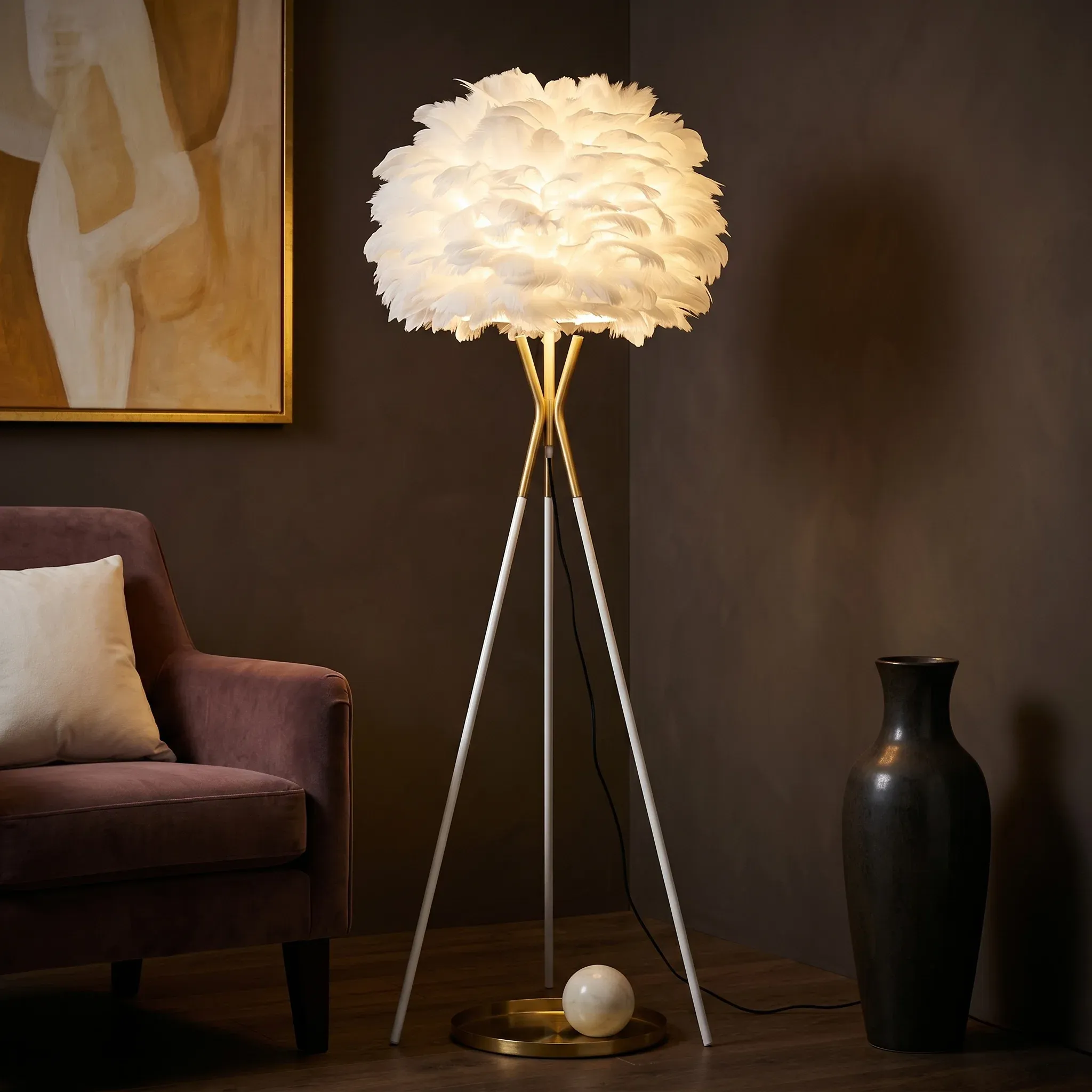 Feather floor lamp lit in a living room corner beside an armchair and side table