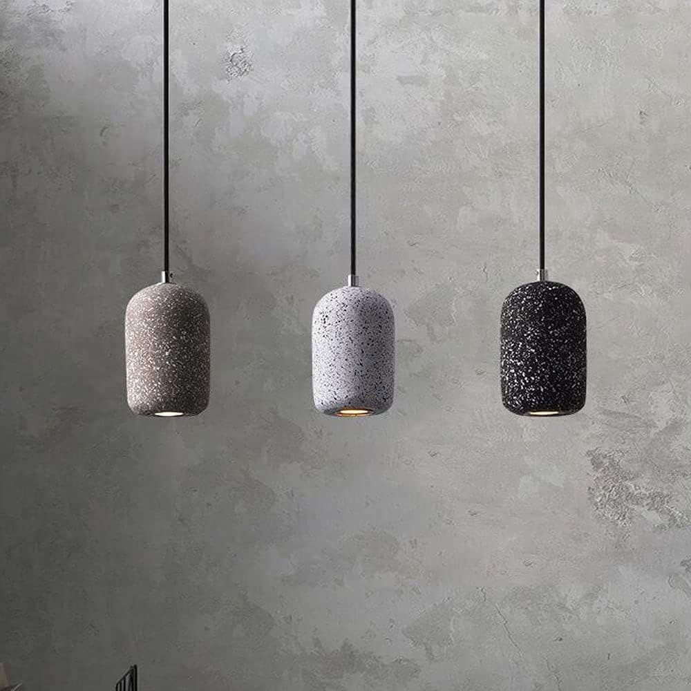 White and black cement pendant lights on white background
