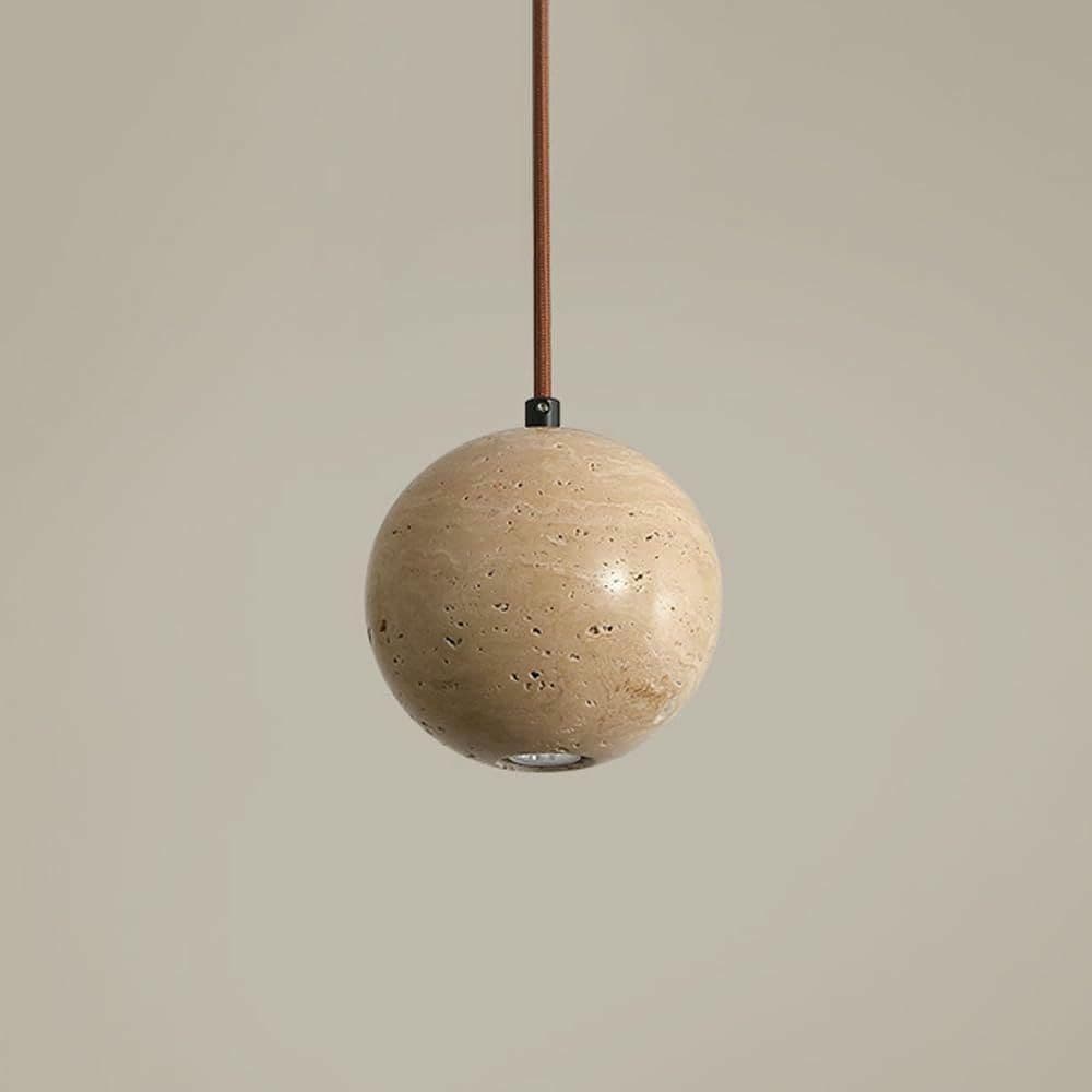 Single marble globe pendant light lit warm