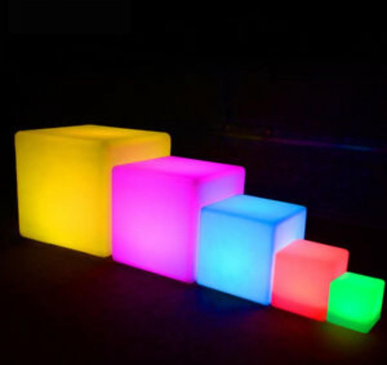 RGB LED cube lights in multiple sizes and colours glowing on a dark background