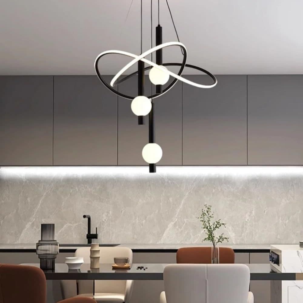 Black modern LED pendant chandelier lit warm in a room setting
