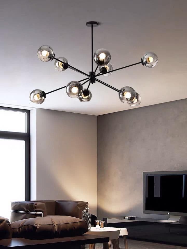 Black multi-arm chandelier hanging in a living room