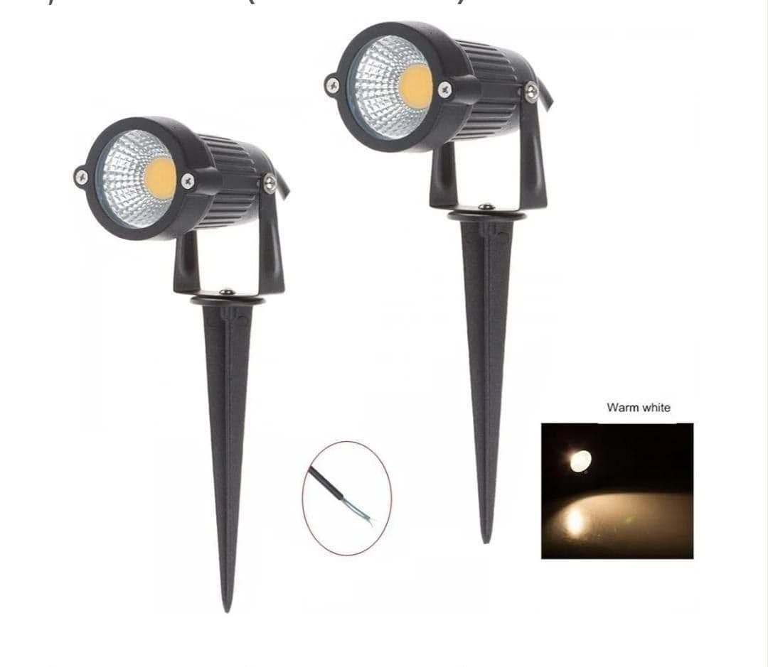 Two 7W COB LED garden spotlights on ground spikes