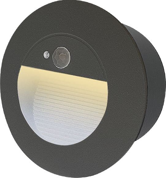 Black round LED step light with motion sensor on plain background