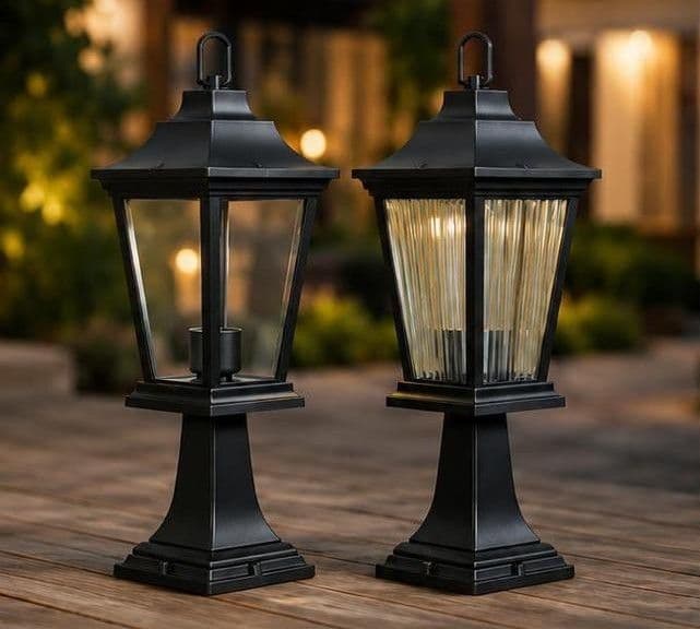 Stand garden lights in stripe and clear glass, lit, side by side outdoors
